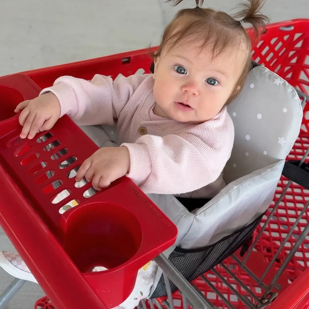 Bébé dans siège caddie Nidou